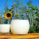 2 clear glass pitcher with milk